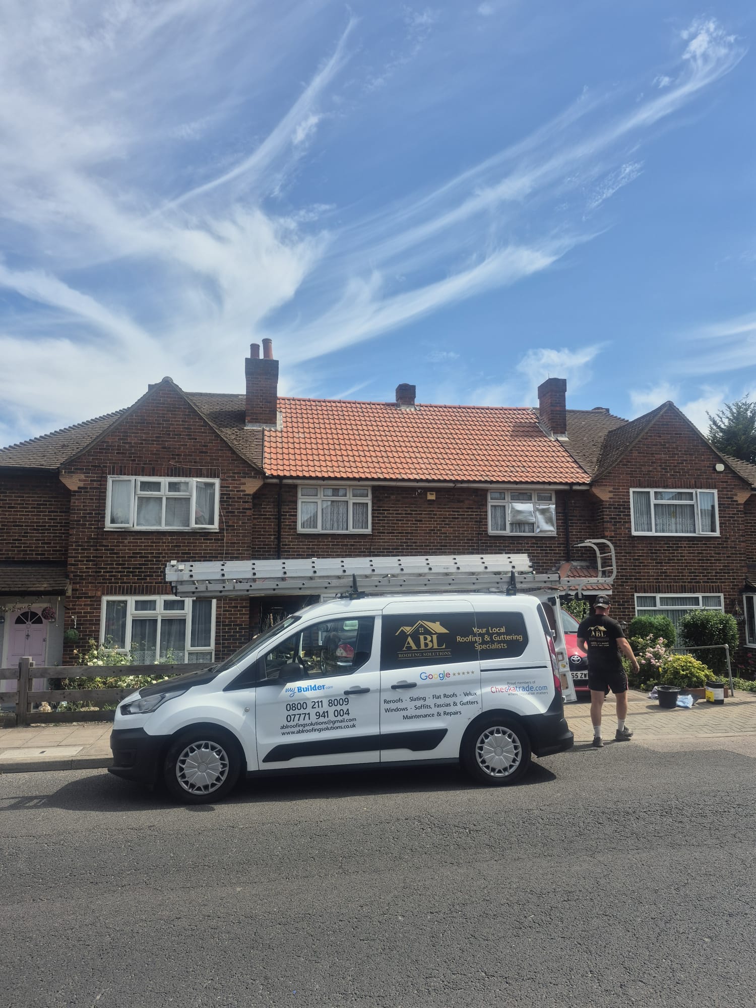 ABL Roofing Solutions branded van outside a completed re-roof project