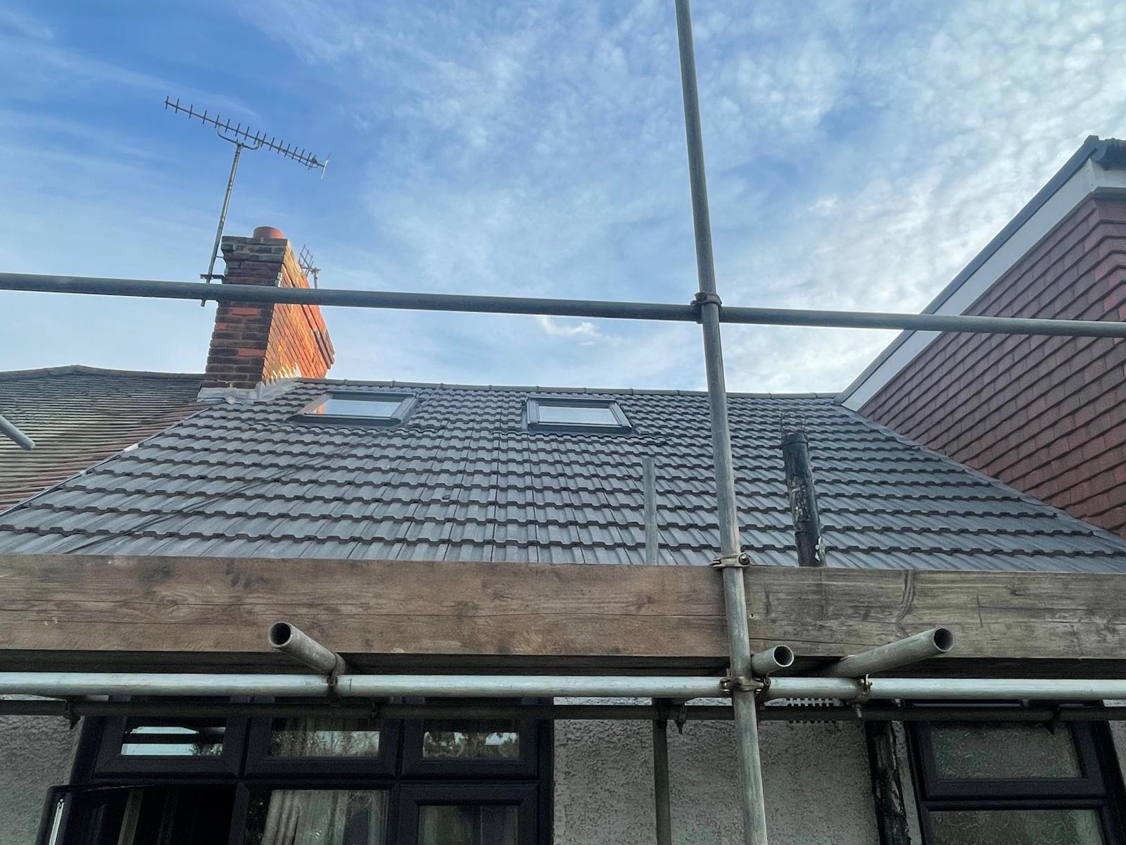 Completed re-tile with two new Velux windows and clean chimney flashings