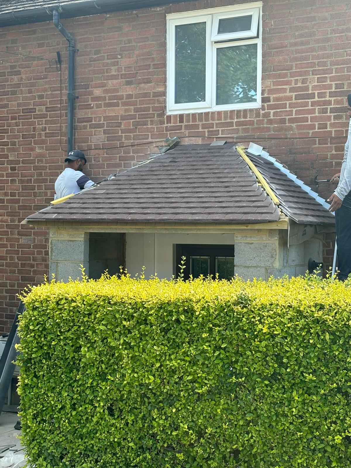 ABL Roofing team re-tiling a porch hip roof in Surrey