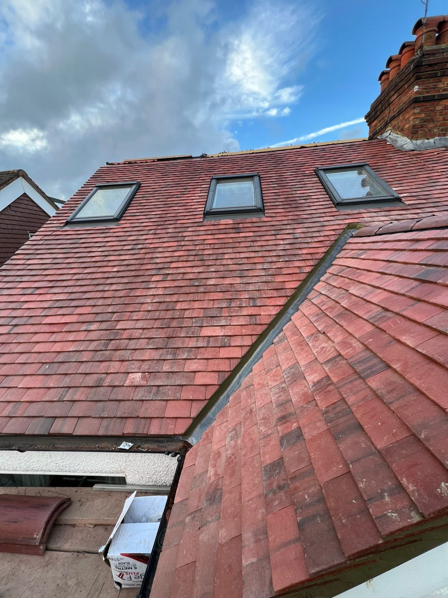 New handmade clay tile roof with three Velux windows