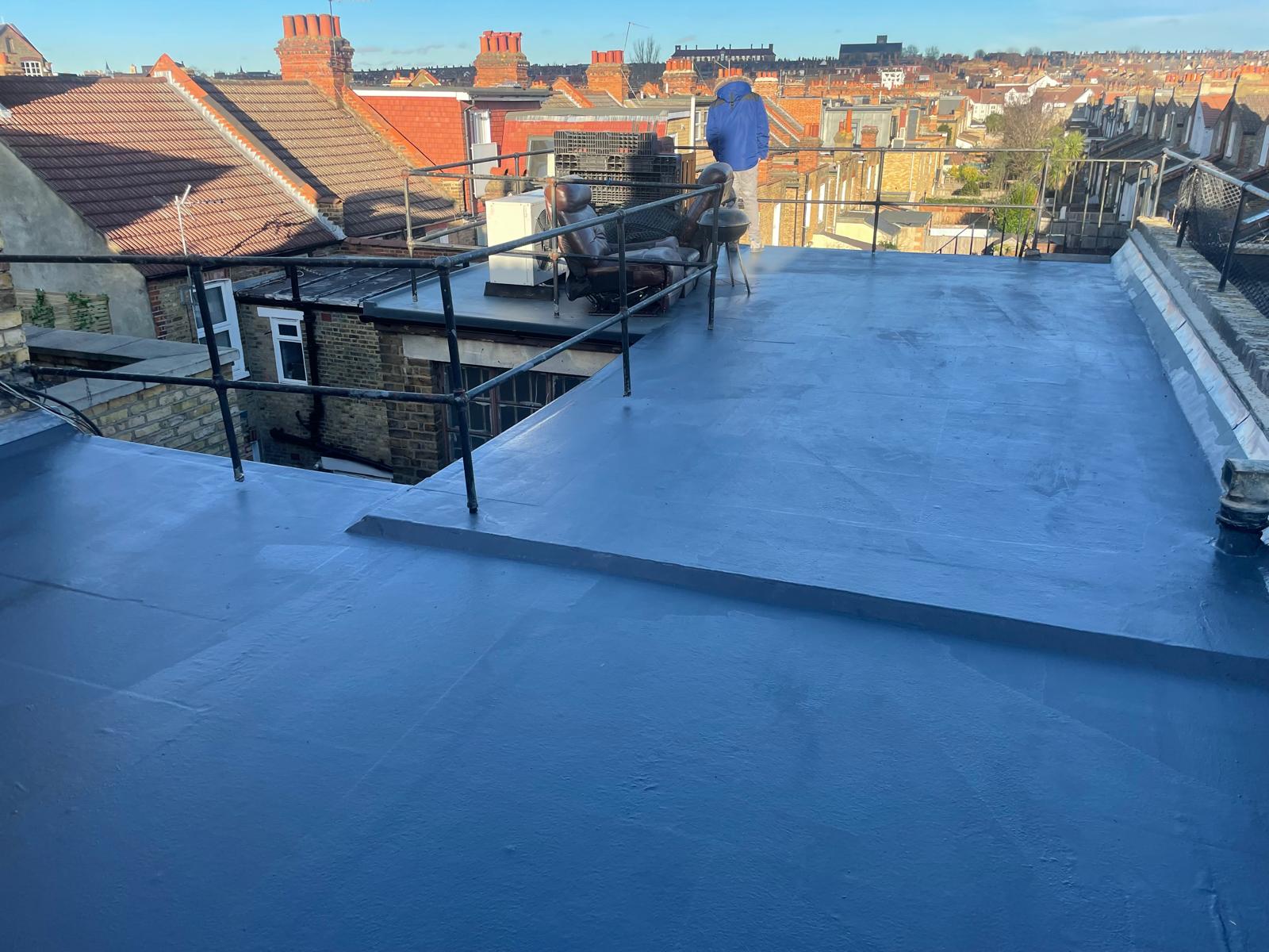 Finished GRP flat roof with railing above a South London terrace