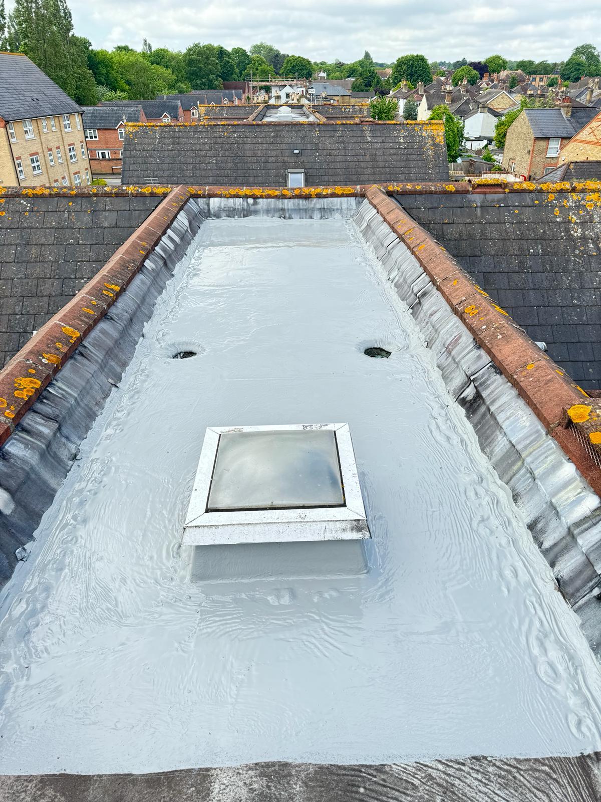 New GRP fibreglass flat roof with central skylight — completed job