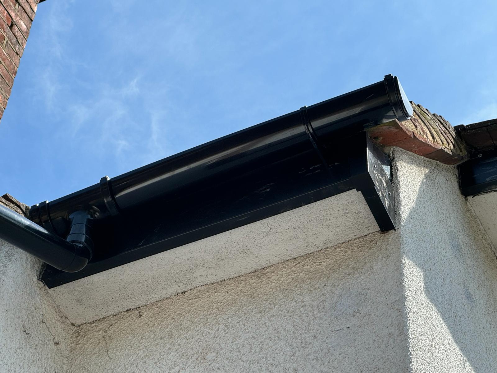 New black uPVC fascias, soffits and guttering close-up