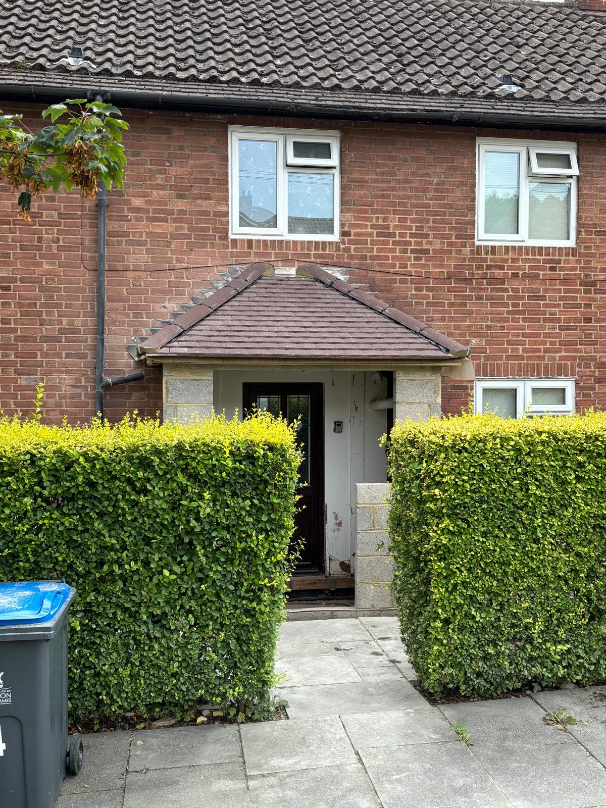 Porch roof and lead flashing prior to repair