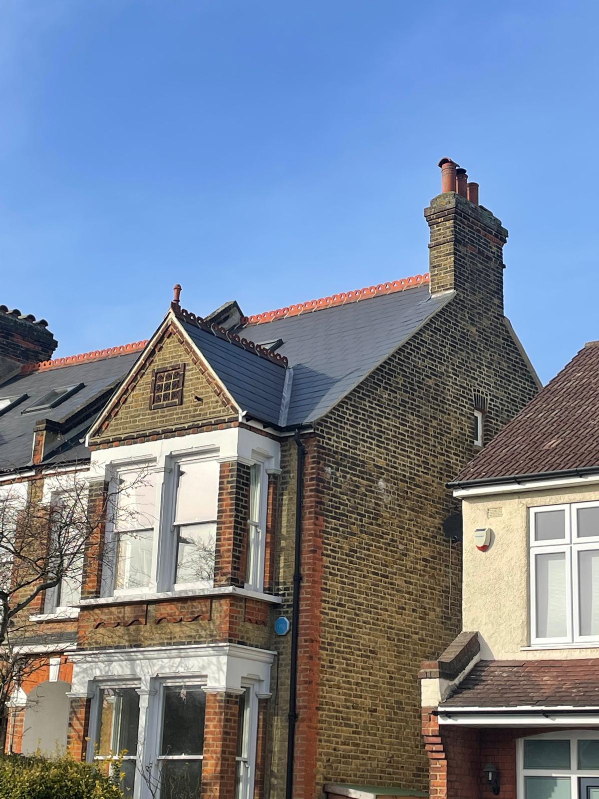 New slate roof and chimney with fresh clay ridge tiles