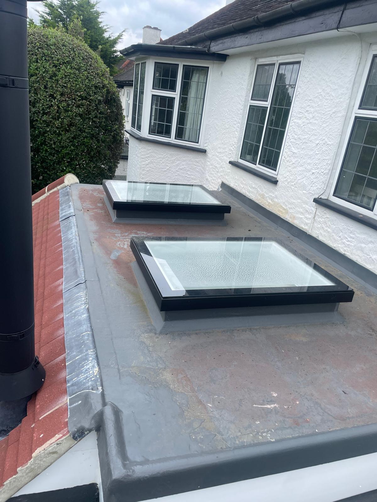 New GRP fibreglass flat roof with twin skylights on a Surrey bungalow