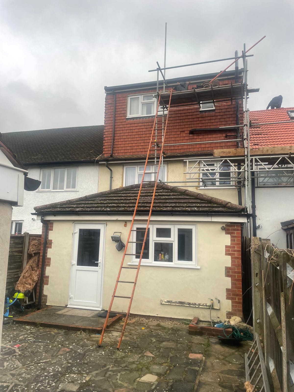 Full re-tile in progress on a two-storey rear extension