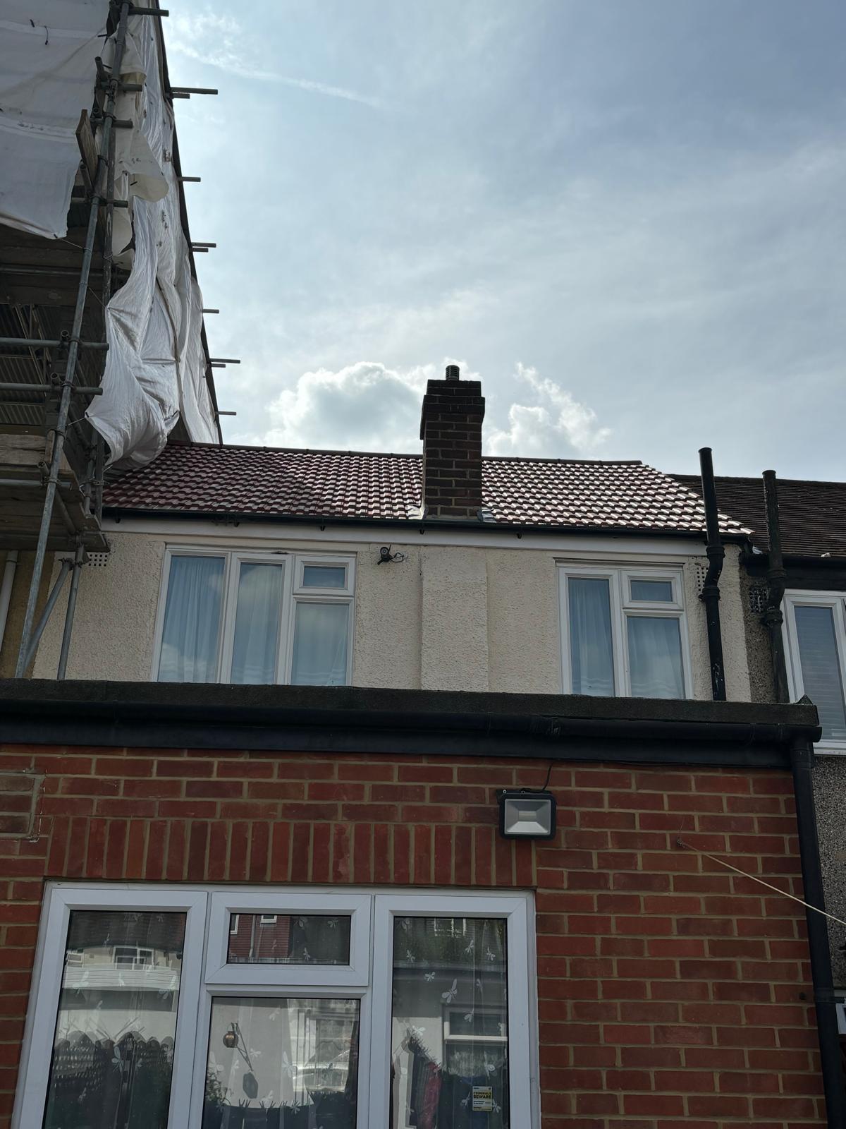 Freshly re-tiled roof with new chimney lead flashing